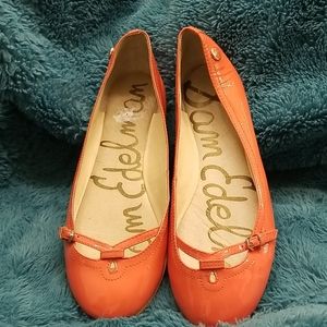 Orange patent leather flats